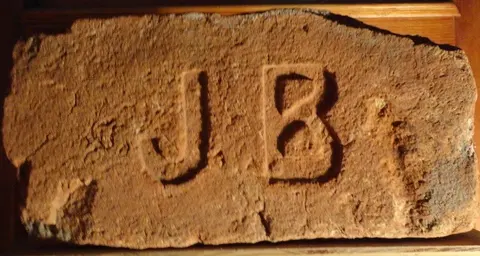 Značka J B