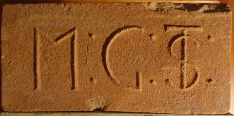 Značka M . G . TS .
